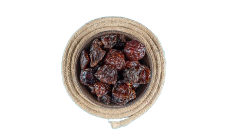 bowl dried plums trivet blue table removebg preview